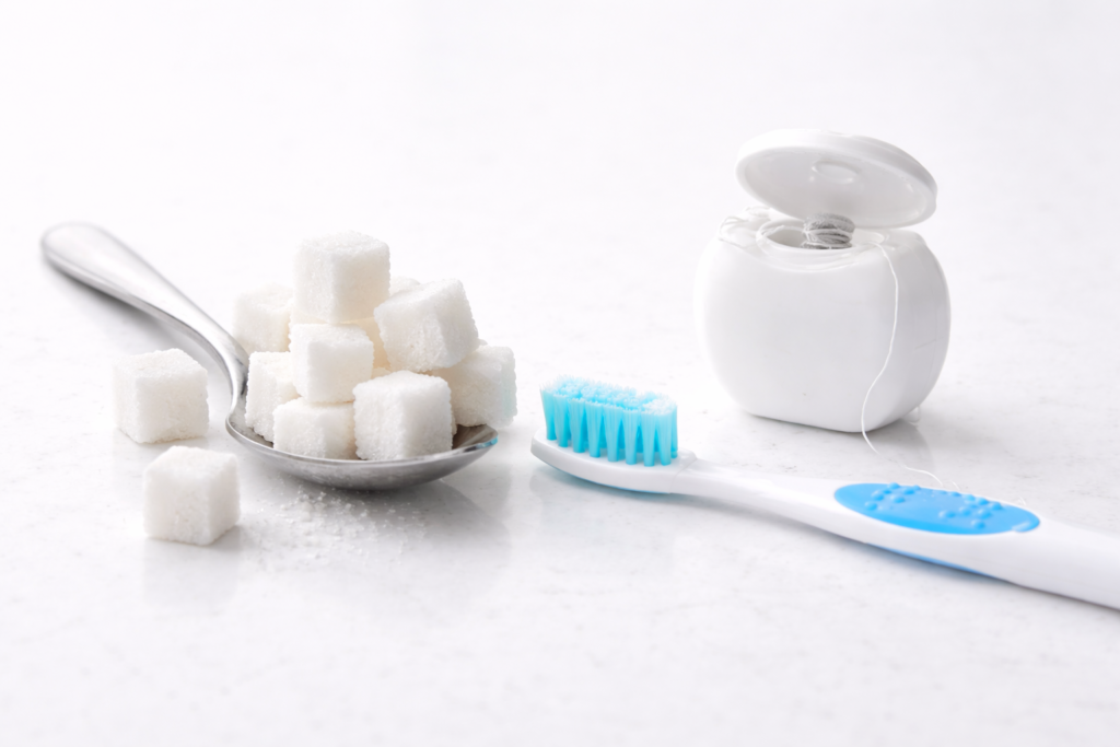 Cukraus vartojimo dažnis – vienas svarbiausių veiksnių, didinančių karieso riziką.